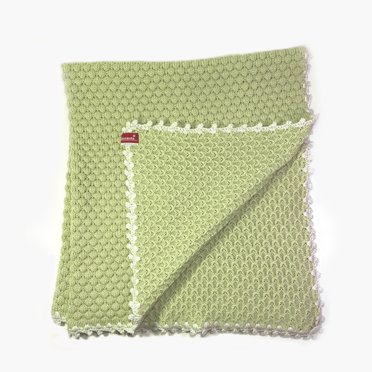 Gestrickte Babydecke aus Merinowolle im Muschelmuster mit Mäusezähnchen umhäkelt in Matchagrün