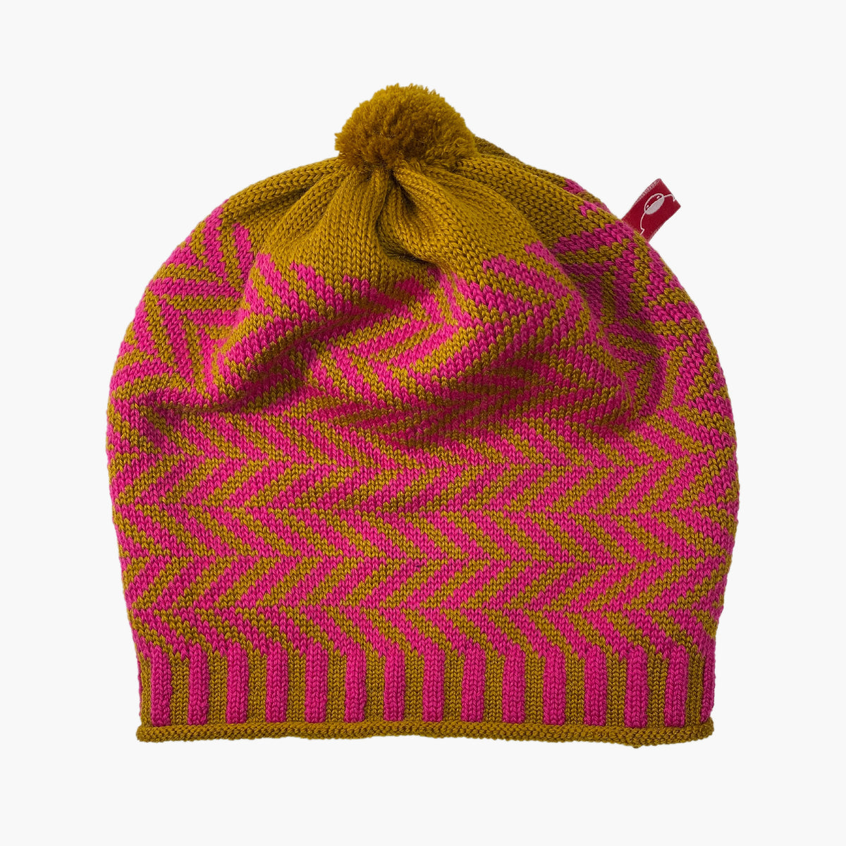 Bronce/Pinkfarbene Beanie-Mütze aus Merinowolle mit längs gestreiften elastischem Bündchen. Die Mütze ist im klassichem Fischgrätmuster gestrickt und hat eine kleine unauffällige Bommel.